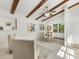 Bright dining area featuring exposed wood beams, modern furnishings and lots of natural light at 1325 Rock Point Rd, Charlotte, NC 28270