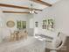 Cozy dining area with neutral tones, wood beams, large windows, and modern furnishings at 1325 Rock Point Rd, Charlotte, NC 28270