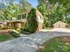 Two-story home with lush landscaping, an extended driveway, and a detached garage at 1325 Rock Point Rd, Charlotte, NC 28270