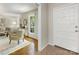 Welcoming foyer featuring decorative flooring that leads to a sunny living room with parquet wood floors at 1325 Rock Point Rd, Charlotte, NC 28270