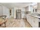 Open concept kitchen with stainless steel appliances, and neutral color palate at 1325 Rock Point Rd, Charlotte, NC 28270