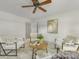 Living room featuring ceiling fan, decor, and an open doorway at 1325 Rock Point Rd, Charlotte, NC 28270