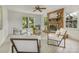 Bright and inviting living room with exposed brick fireplace and many windows at 1325 Rock Point Rd, Charlotte, NC 28270