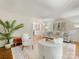 Elegant living room with neutral decor, white sofas, a decorative rug, and a view into other living areas at 1325 Rock Point Rd, Charlotte, NC 28270