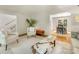 Bright living room showcasing neutral furniture, parquet floors, and a view into the dining room at 1325 Rock Point Rd, Charlotte, NC 28270