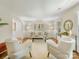 Bright living room with stylish furniture, neutral tones, parquet floors, and natural light from large windows at 1325 Rock Point Rd, Charlotte, NC 28270