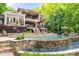 Stunning backyard with a pool, water feature, and lush landscaping, perfect for outdoor living at 135 Sumter Dr, Mooresville, NC 28117