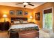 Comfortable bedroom with neutral carpeting, wood trim and multiple framed images on the warm-colored walls at 135 Sumter Dr, Mooresville, NC 28117