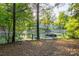 A private boat dock on the lake with a view of neighborhood homes in the background at 135 Sumter Dr, Mooresville, NC 28117