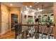 Bright foyer with balcony and ornate railings overlooking a grand two-story living space with a tray ceiling at 135 Sumter Dr, Mooresville, NC 28117