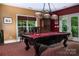 Game room with a pool table, stylish lighting, and comfortable seating, great for entertainment at 135 Sumter Dr, Mooresville, NC 28117