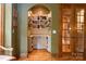 Hallway with beautiful shelving, storage space, hardwood floors and arched doorway at 135 Sumter Dr, Mooresville, NC 28117