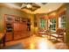 Cozy office space featuring wood floors, custom built-ins, and ample natural light at 135 Sumter Dr, Mooresville, NC 28117