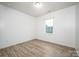 This bedroom has hardwood floors and a window that provides great natural light at 150 Falls Cove Dr, Troutman, NC 28166