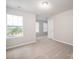 Bedroom offers carpeted flooring, neutral paint, and a window providing natural light at 150 Falls Cove Dr, Troutman, NC 28166