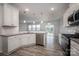 Modern kitchen featuring white cabinets, stainless steel appliances, and granite countertops at 150 Falls Cove Dr, Troutman, NC 28166