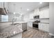 Modern kitchen featuring white cabinets, stainless steel appliances, and granite countertops at 150 Falls Cove Dr, Troutman, NC 28166