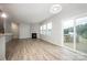 Open-concept living area leads to the outdoor patio through glass sliding doors at 150 Falls Cove Dr, Troutman, NC 28166