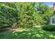 Lush backyard with a large tree line that creates natural privacy at 15000 Strathmoor Dr, Charlotte, NC 28277