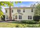 A house exterior and backyard view with grass and patio furniture at 15000 Strathmoor Dr, Charlotte, NC 28277