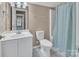 Cozy bathroom with a sink, toilet and a shower/tub combination at 15000 Strathmoor Dr, Charlotte, NC 28277