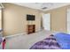 Neutral bedroom with a TV on top of a wood bookcase at 15000 Strathmoor Dr, Charlotte, NC 28277