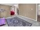 Bonus room with plush carpet, natural light, treadmill, and a bean bag chair at 15000 Strathmoor Dr, Charlotte, NC 28277