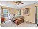 Cozy bedroom featuring a tray ceiling, plush carpet, and comfortable king sized bed at 15000 Strathmoor Dr, Charlotte, NC 28277