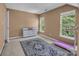 Spacious bedroom with plush carpet, natural light, and treadmill for exercise at 15000 Strathmoor Dr, Charlotte, NC 28277