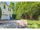 Long driveway leading to the home's garage and side entrance at 15000 Strathmoor Dr, Charlotte, NC 28277