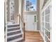 Bright foyer featuring hardwood floors, a staircase, a front door with sidelights, and french doors at 15000 Strathmoor Dr, Charlotte, NC 28277