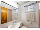 Bathroom features a white sink, toilet, and shower and nice mirror at 1521 19Th Sw St, Hickory, NC 28602