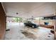 Spacious carport featuring a sleek black car, ample space for parking, and a partial view of the backyard at 1521 19Th Sw St, Hickory, NC 28602