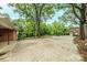 Wide driveway leads to a well-maintained brick home with a basketball hoop and lush greenery at 1521 19Th Sw St, Hickory, NC 28602