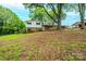Charming split-level home with brick and siding exterior, mature trees, and a covered parking area at 1521 19Th Sw St, Hickory, NC 28602