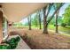 Scenic front yard featuring mature trees and landscaping as seen from the covered porch at 1521 19Th Sw St, Hickory, NC 28602