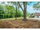 Lush front yard with a stone path leading to a brick home featuring a basketball hoop over the garage at 1521 19Th Sw St, Hickory, NC 28602