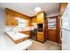 Cozy kitchen featuring wooden cabinets, stainless steel appliances, and tile flooring at 1521 19Th Sw St, Hickory, NC 28602