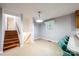 Kitchen area featuring a breakfast bar and stairs leading to a lower level at 1521 19Th Sw St, Hickory, NC 28602