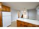Bright eat-in kitchen featuring wooden cabinets and staircase access at 1521 19Th Sw St, Hickory, NC 28602