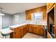 Kitchen with wood cabinets and white countertops offering functionality and style at 1521 19Th Sw St, Hickory, NC 28602