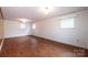 An expansive living room with multiple windows and laminate flooring at 1521 19Th Sw St, Hickory, NC 28602