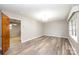 Bright living room showcasing new floors, soft gray walls and classic light fixture at 1521 19Th Sw St, Hickory, NC 28602