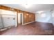 Spacious recreation room featuring retro wood paneling and a built-in laundry hookup at 1521 19Th Sw St, Hickory, NC 28602