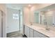 Bathroom featuring double vanity, white cabinets, and hardwood style floors at 1703 Wooten Way, Bessemer City, NC 28016