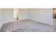 This bedroom features neutral carpeting, a walk-in closet, and an ensuite bathroom at 1703 Wooten Way, Bessemer City, NC 28016