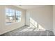 Bedroom features carpeted floors and a large window at 1703 Wooten Way, Bessemer City, NC 28016