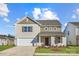 Charming two-story home features a two-car garage, and beautiful landscaping at 1703 Wooten Way, Bessemer City, NC 28016