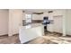 Modern kitchen features white cabinets, stainless steel appliances, and a center island at 1703 Wooten Way, Bessemer City, NC 28016
