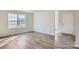 Bright living room features hardwood floors and lots of natural light at 1703 Wooten Way, Bessemer City, NC 28016